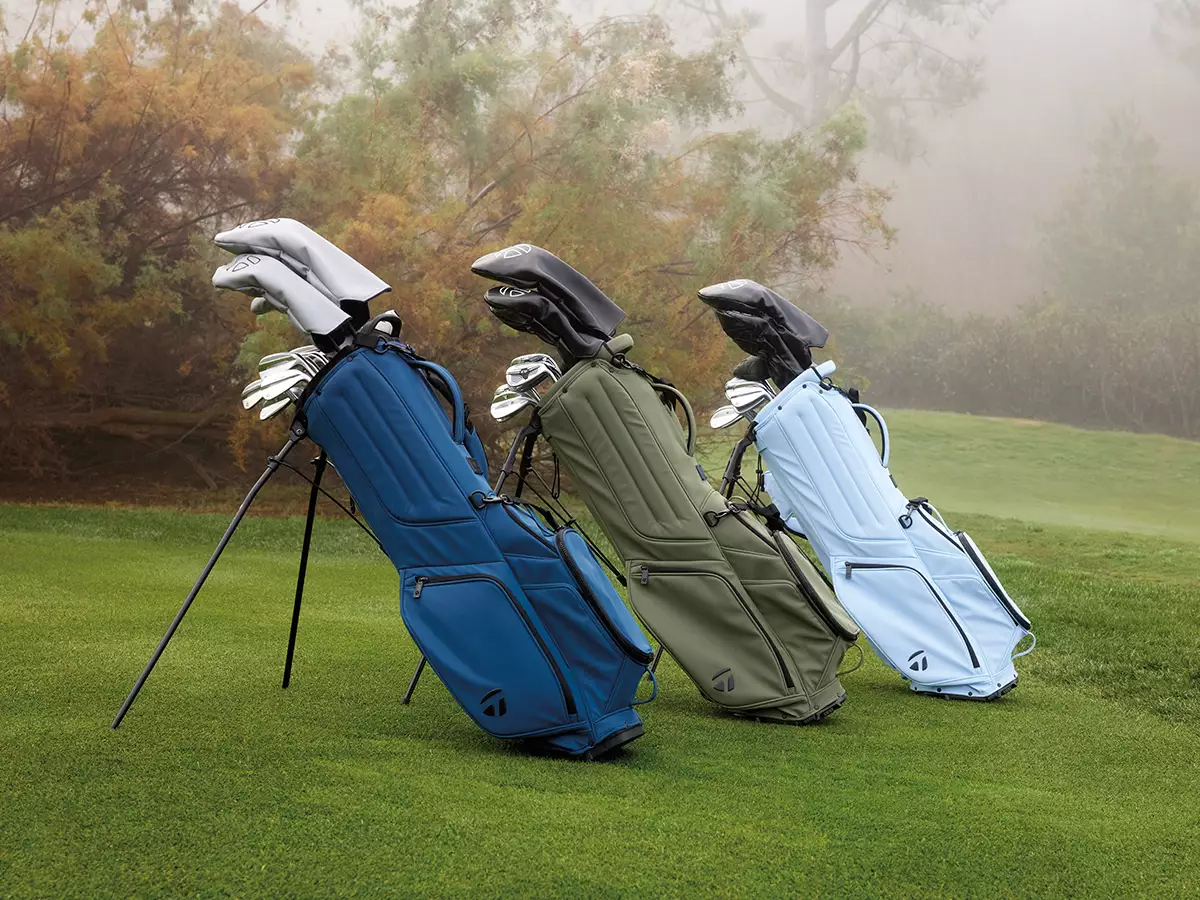 TaylorMade golf stand bags on a misty fairway